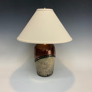 Small Raku lamp in copper with gold splashes
