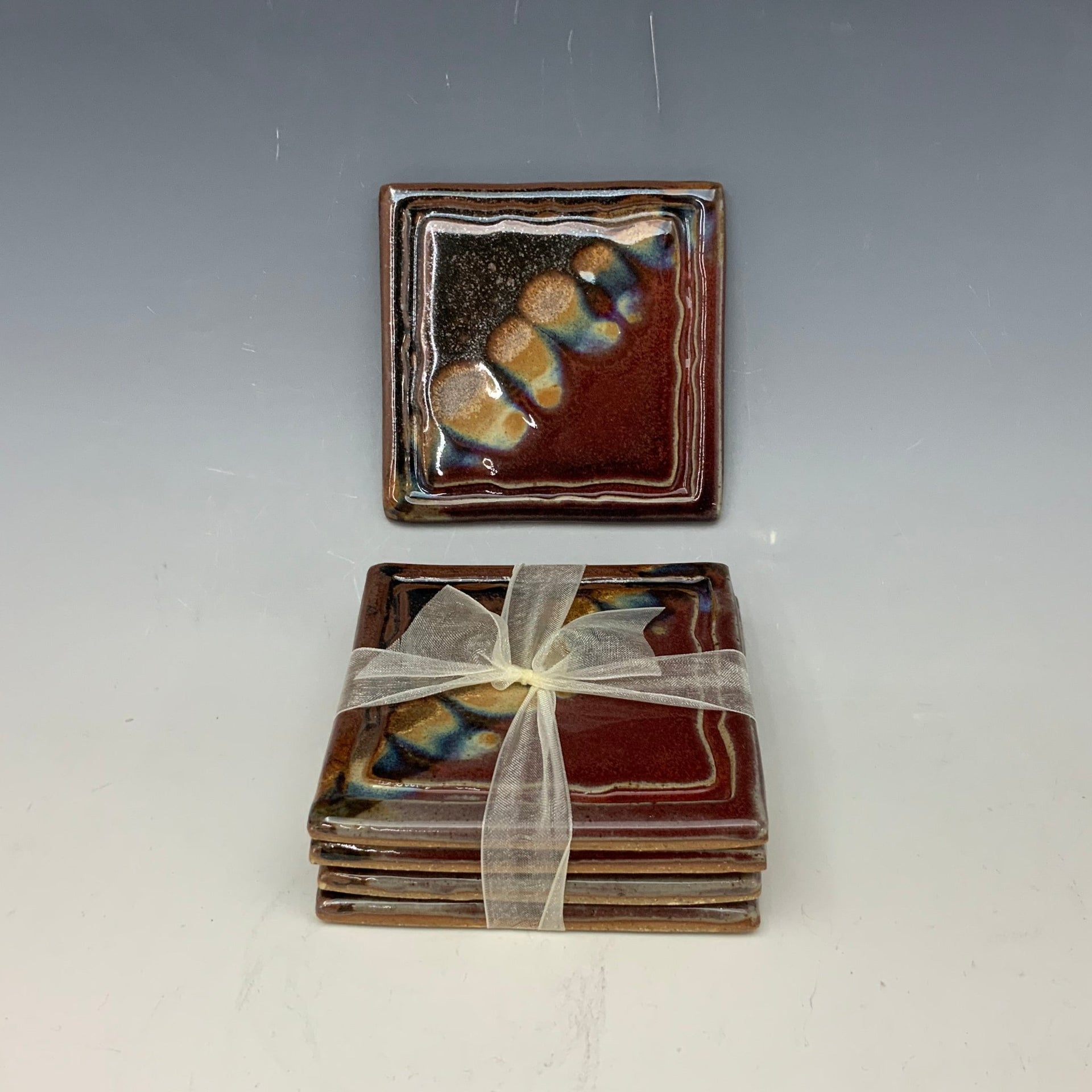 Red and obsidian coaster set
