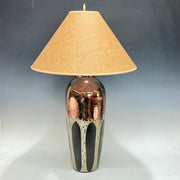 Table lamp with aspen trees and beige shade on a gray background