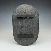 Back of large oval Raku tile