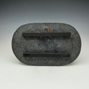 the back of the Raku tile showing the hanger