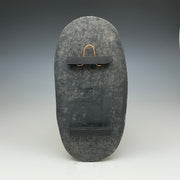 Back of the tall oval Raku tile Showing the hanger