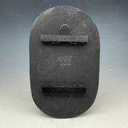 Back of wide oval tile