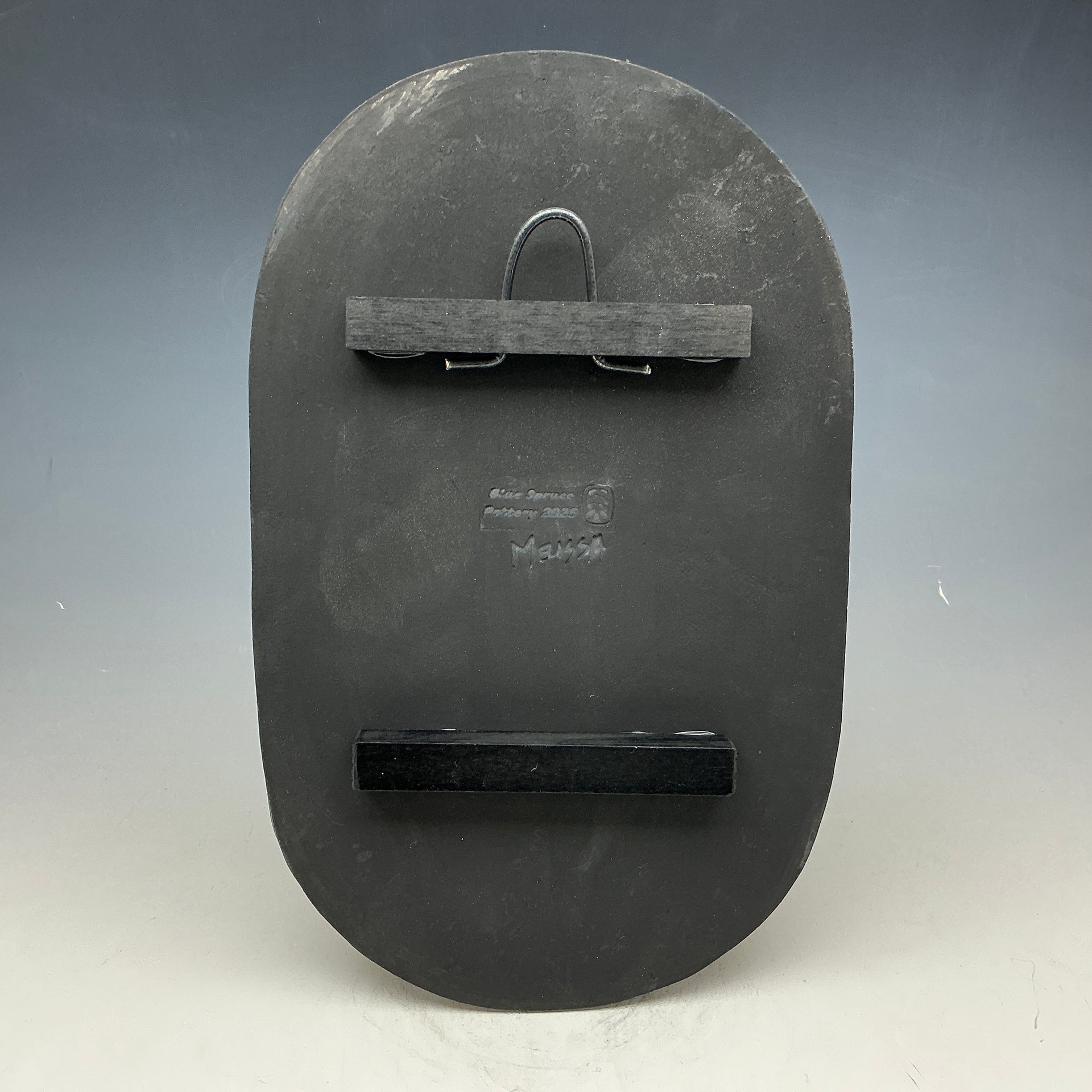 Back of wide oval tile