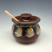 Red and obsidian honey pot