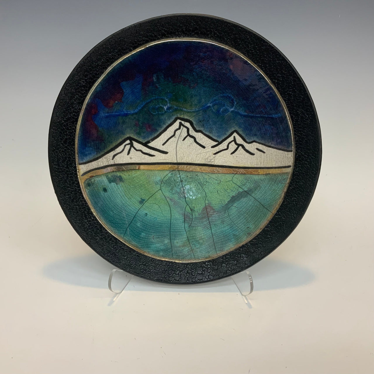 Raku plates with the mountains in a black frame