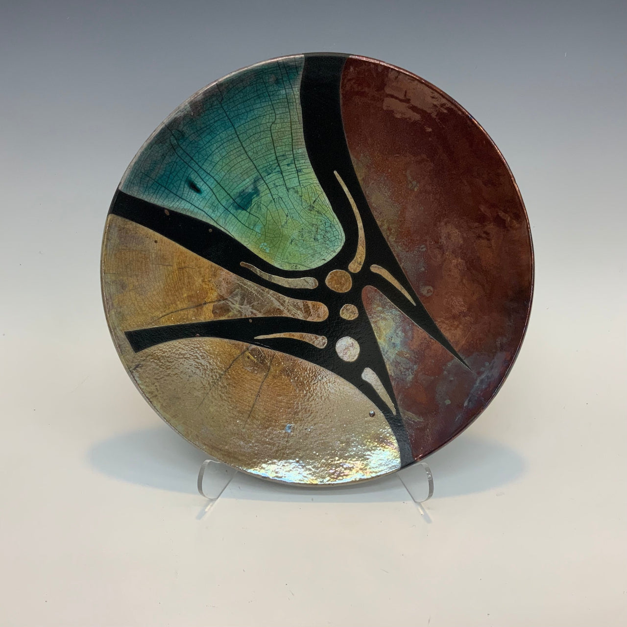 Raku plate in gold copper and teal