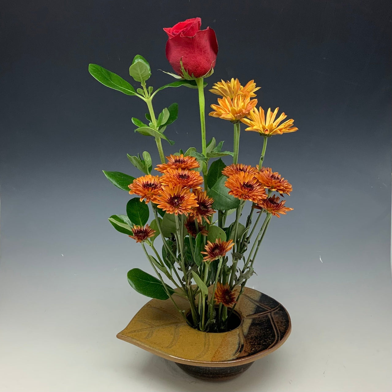 Autumn leaf flower vase with flowers