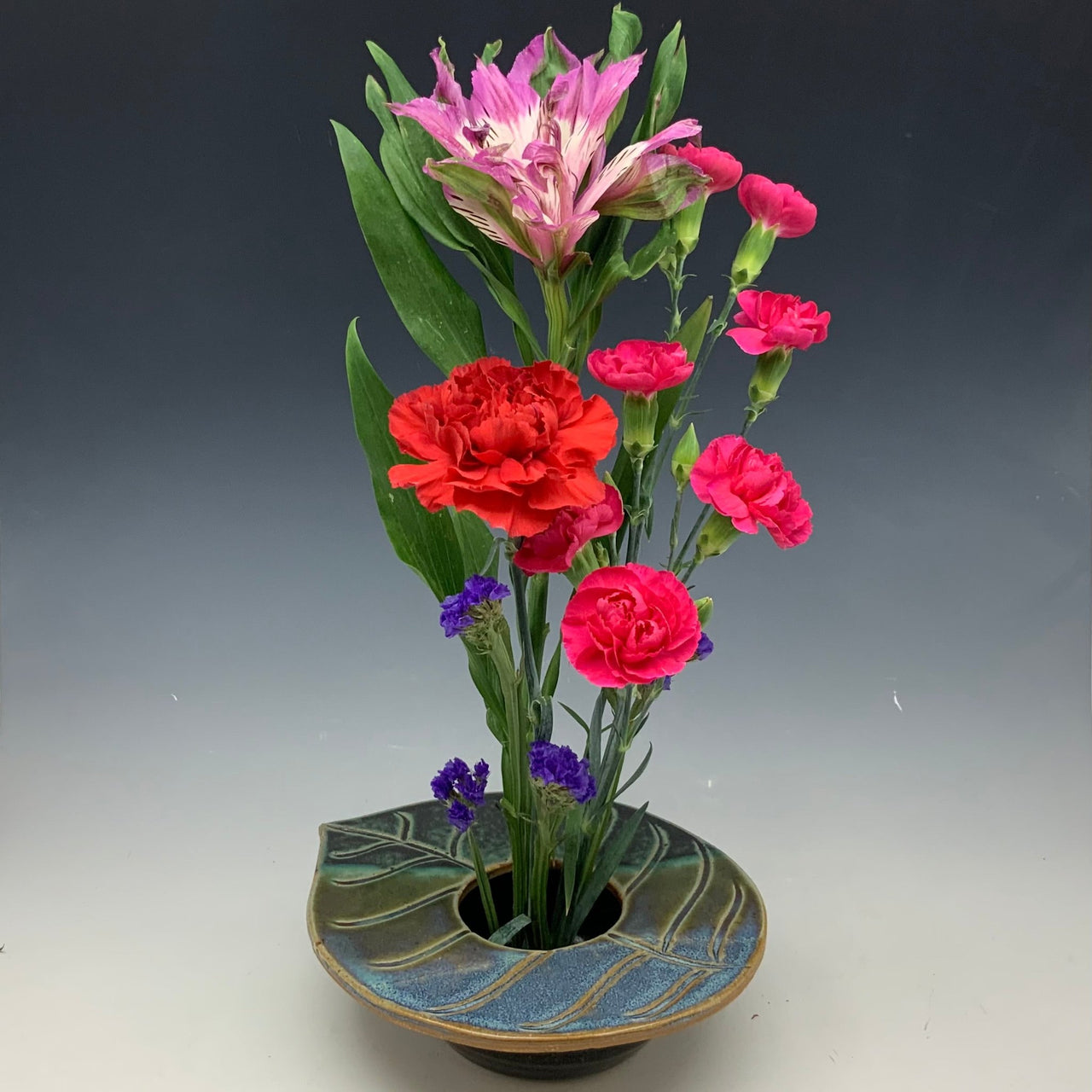 Large spring leaf flower vase with flowers