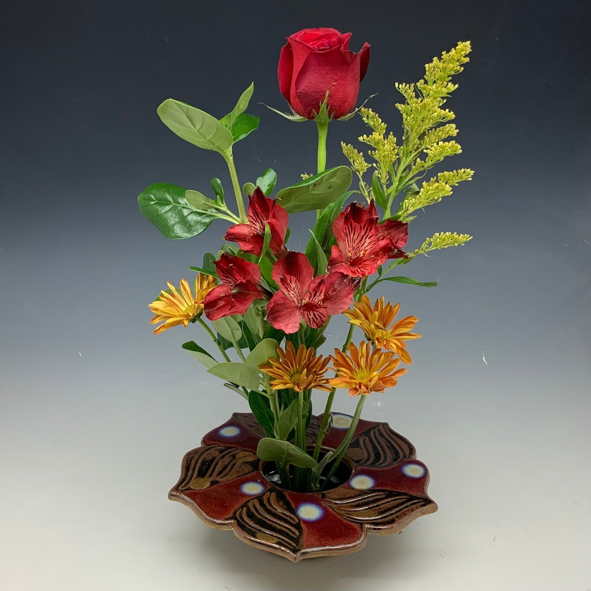 Red lotus vase with flowers