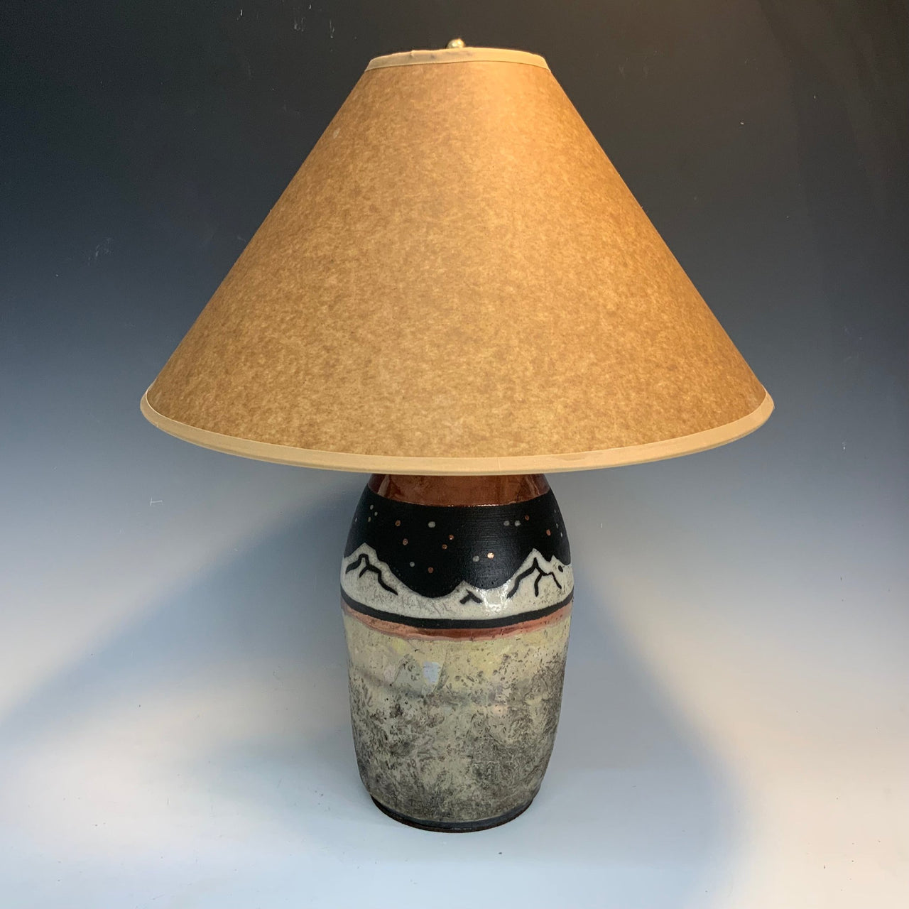 Raku lamp with mountains at night