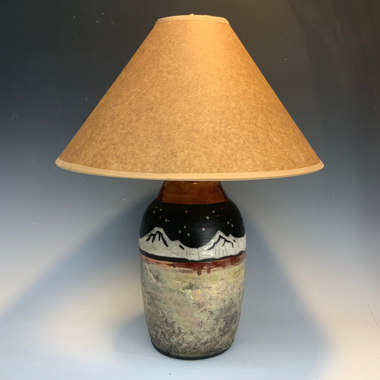 Raku lamp with mountains at night