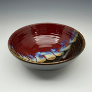 Ceramic bowl with a glossy finish on a gray background