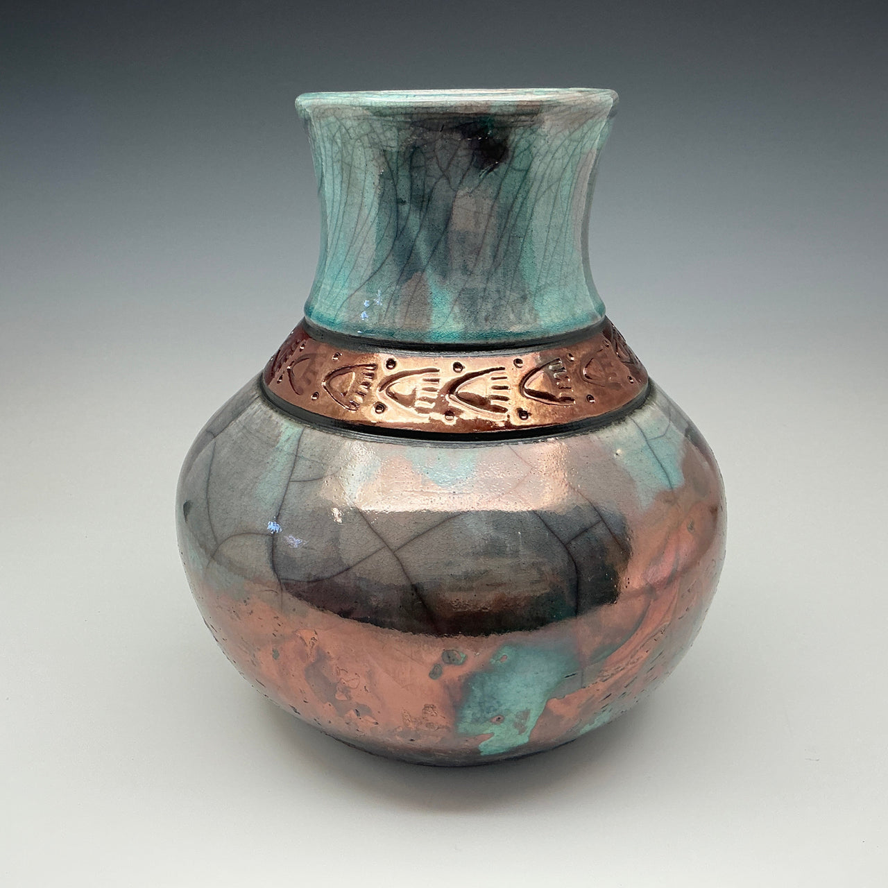 Large teal vase with copper bear prints