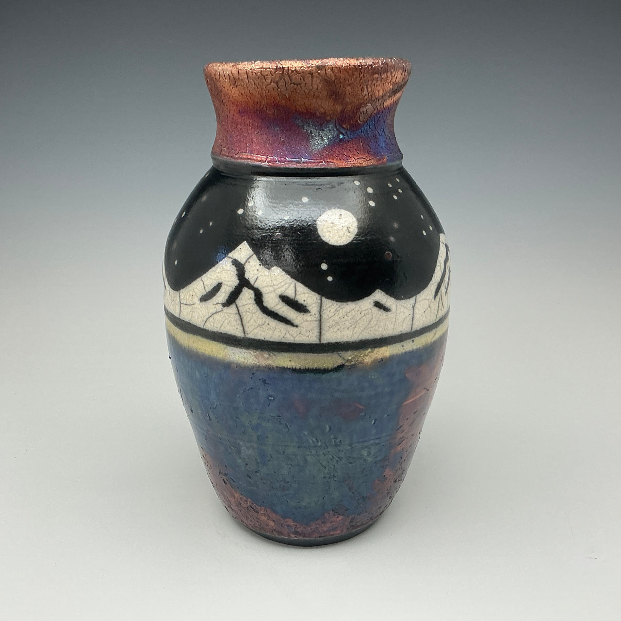 Mountains on the lake under a night sky