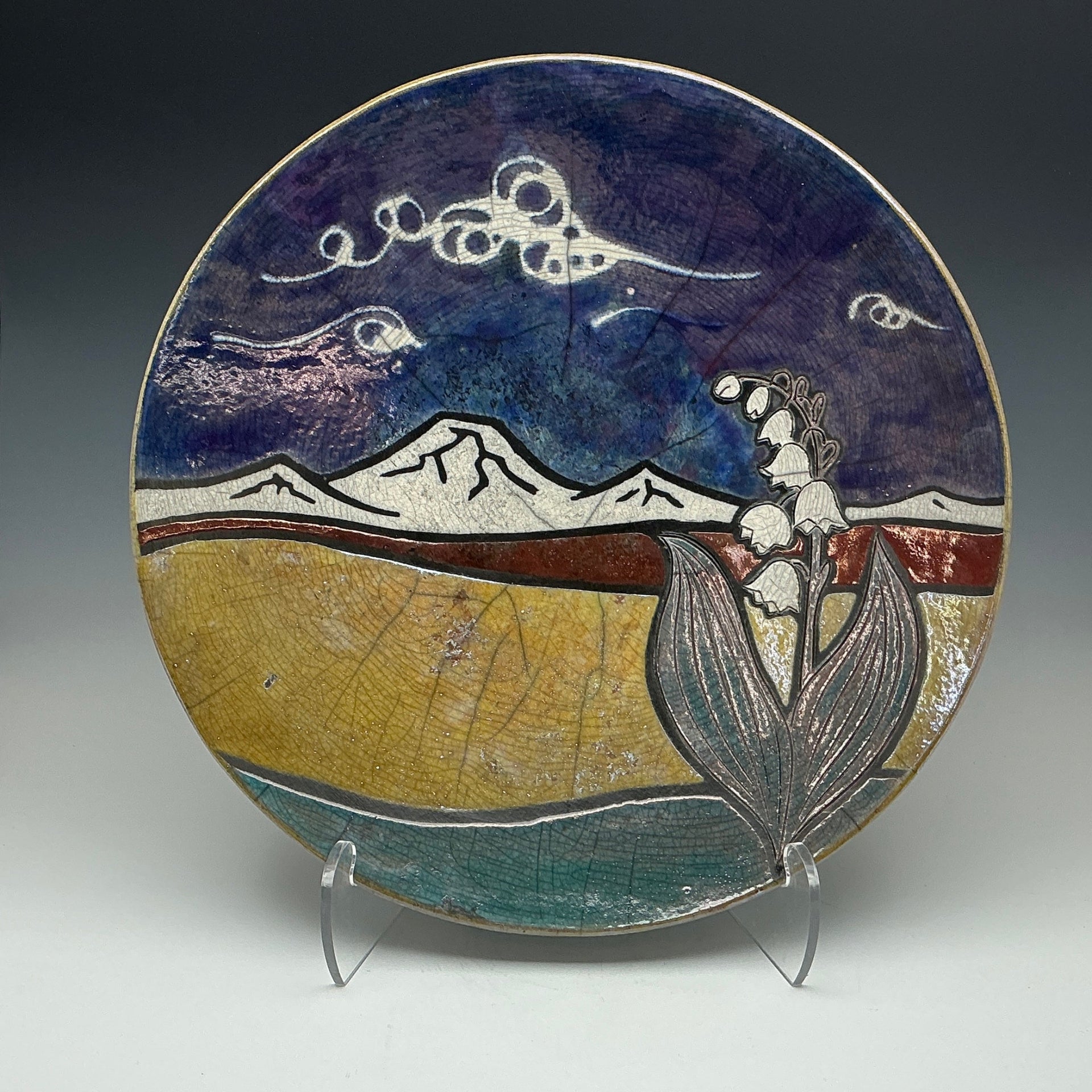 a raku plate with an image of my bachelor and Lillie’s on it.
