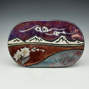 Puffballs blowing in the wind at the mountains