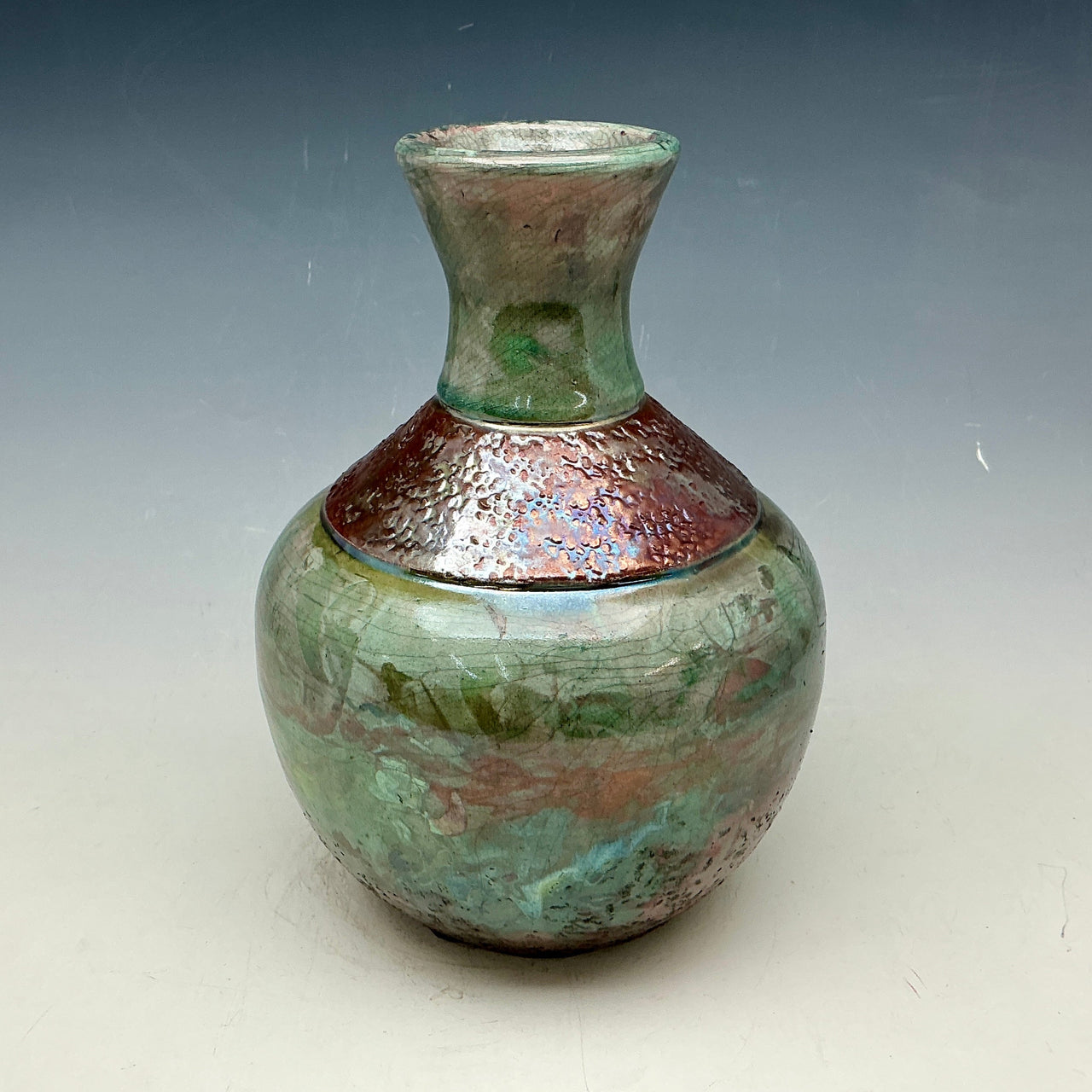 Raku bottle in tea and copper