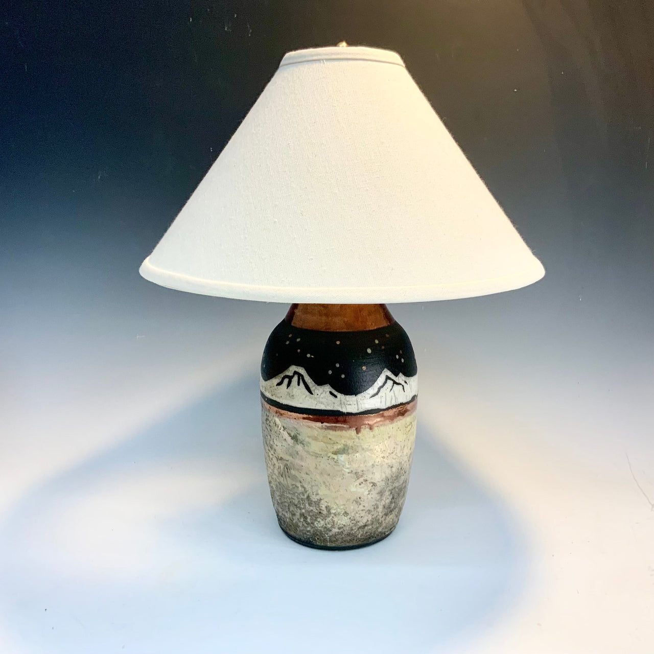 Raku lamp mountains at night
