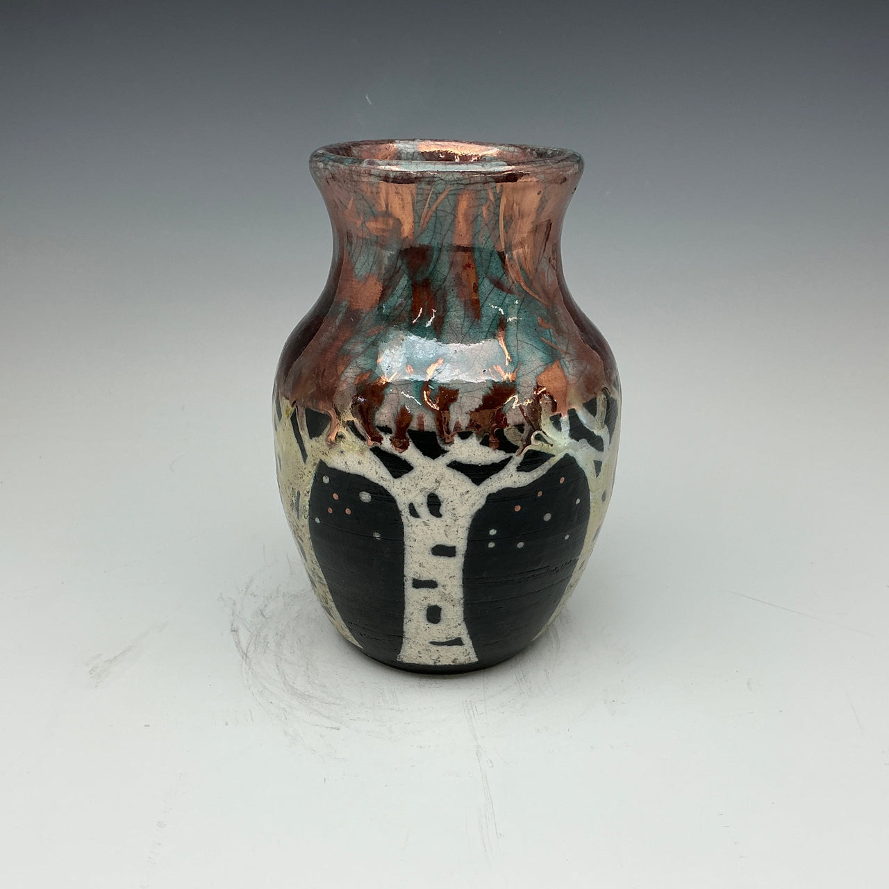 raku vase with aspen tree design done in white, gold and copper colors