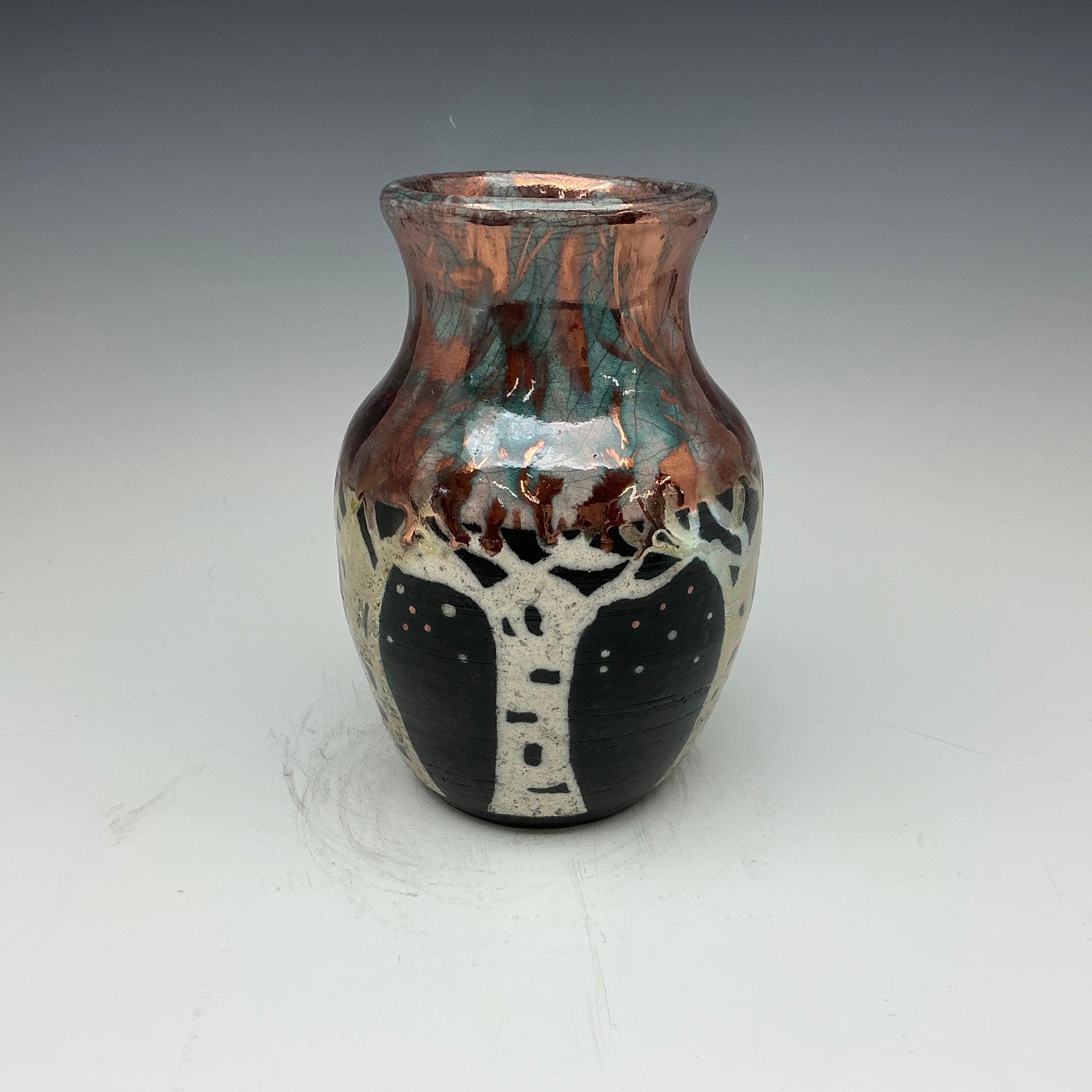 raku vase with aspen tree design done in white, gold and copper colors