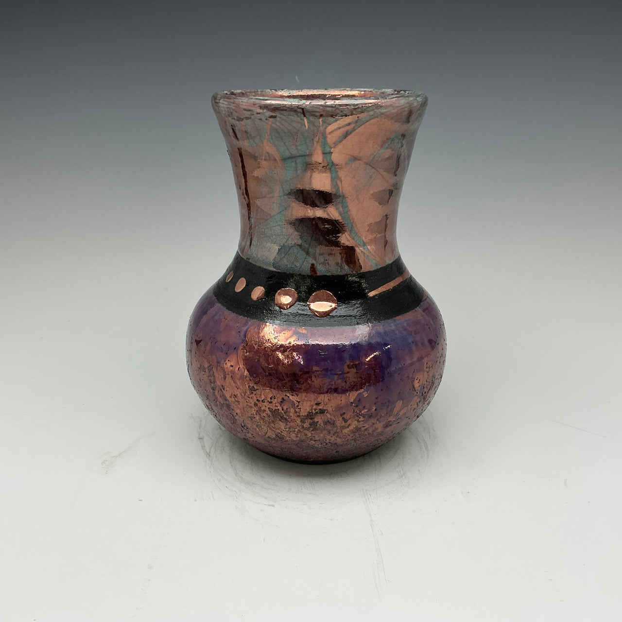 Raku vase in blue and teal with copper designs