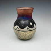 raku vase with white mountains and a starry sky.  