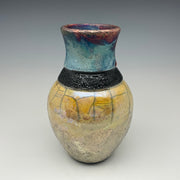 Sparkle and gold bottle with a black necklace