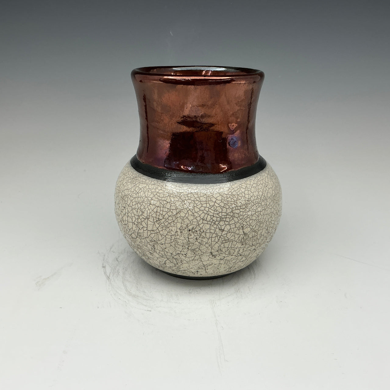 Raku vase with white crackle and copper glaze 